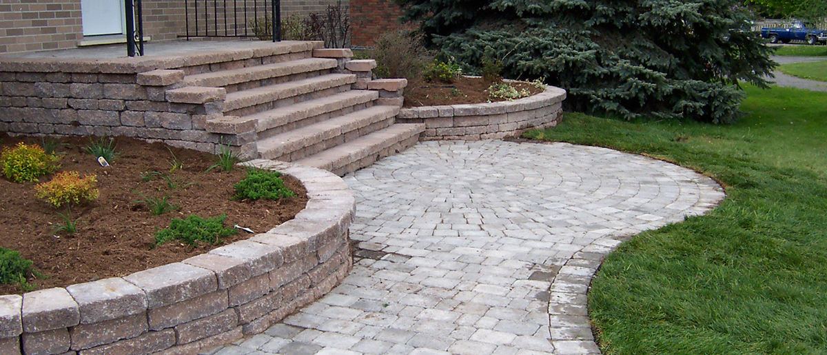 an interlocking stone walkway by Johnston's Greenhouse